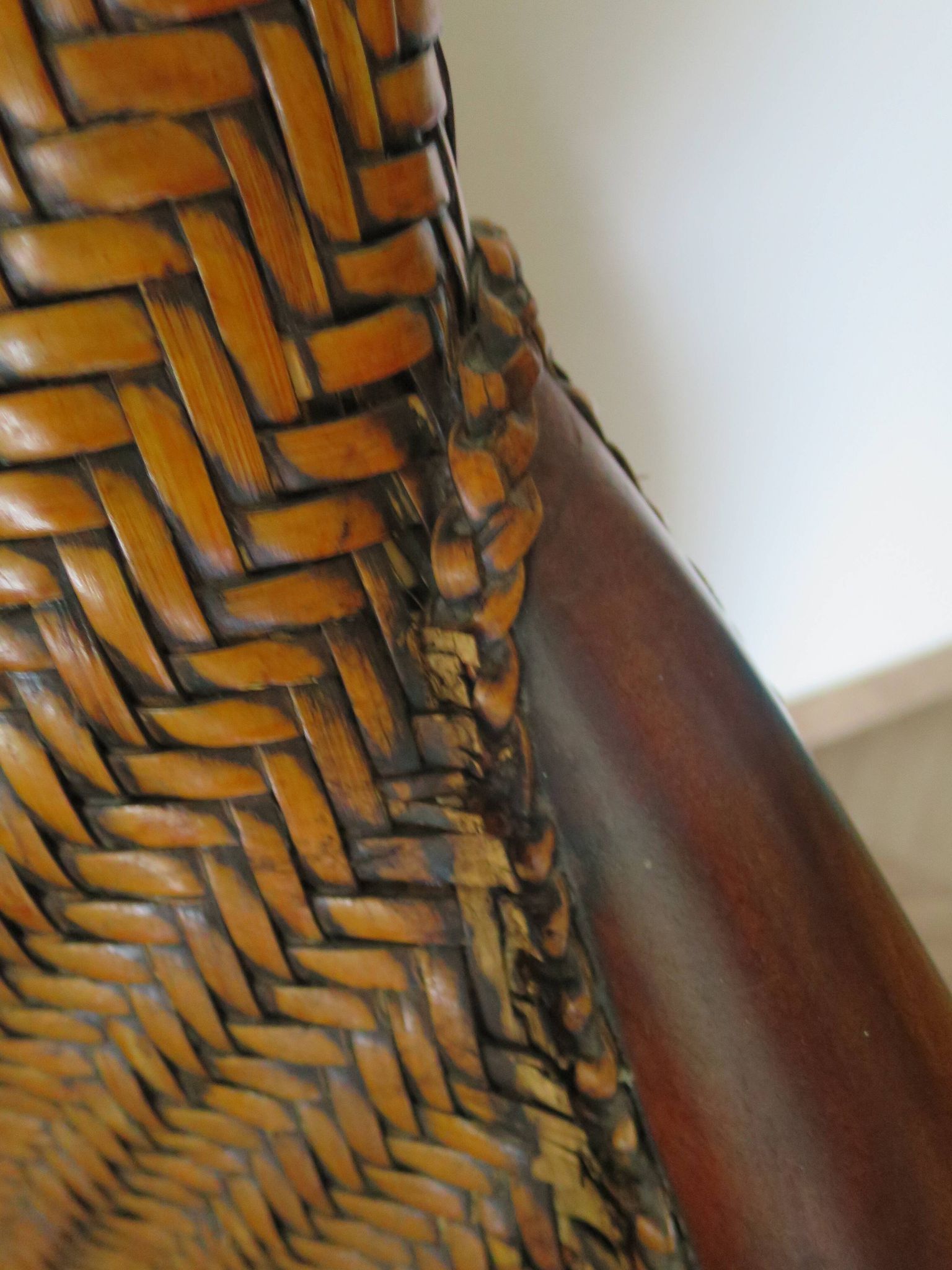 Woven rattan armchair and exotic wood in colonial style, 1980s.