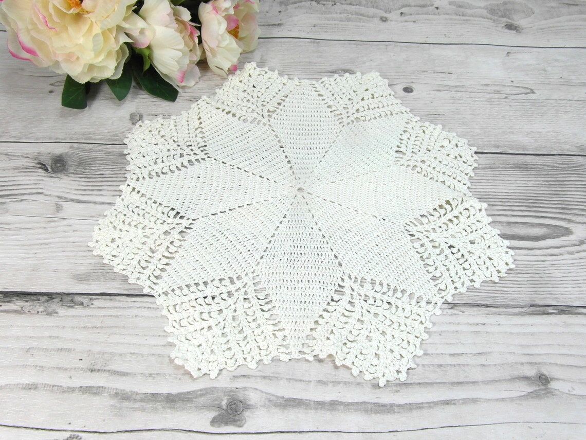 Handmade round placemat in crocheted cotton lace