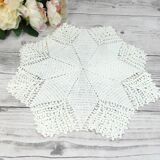 Handmade round placemat in crocheted cotton lace