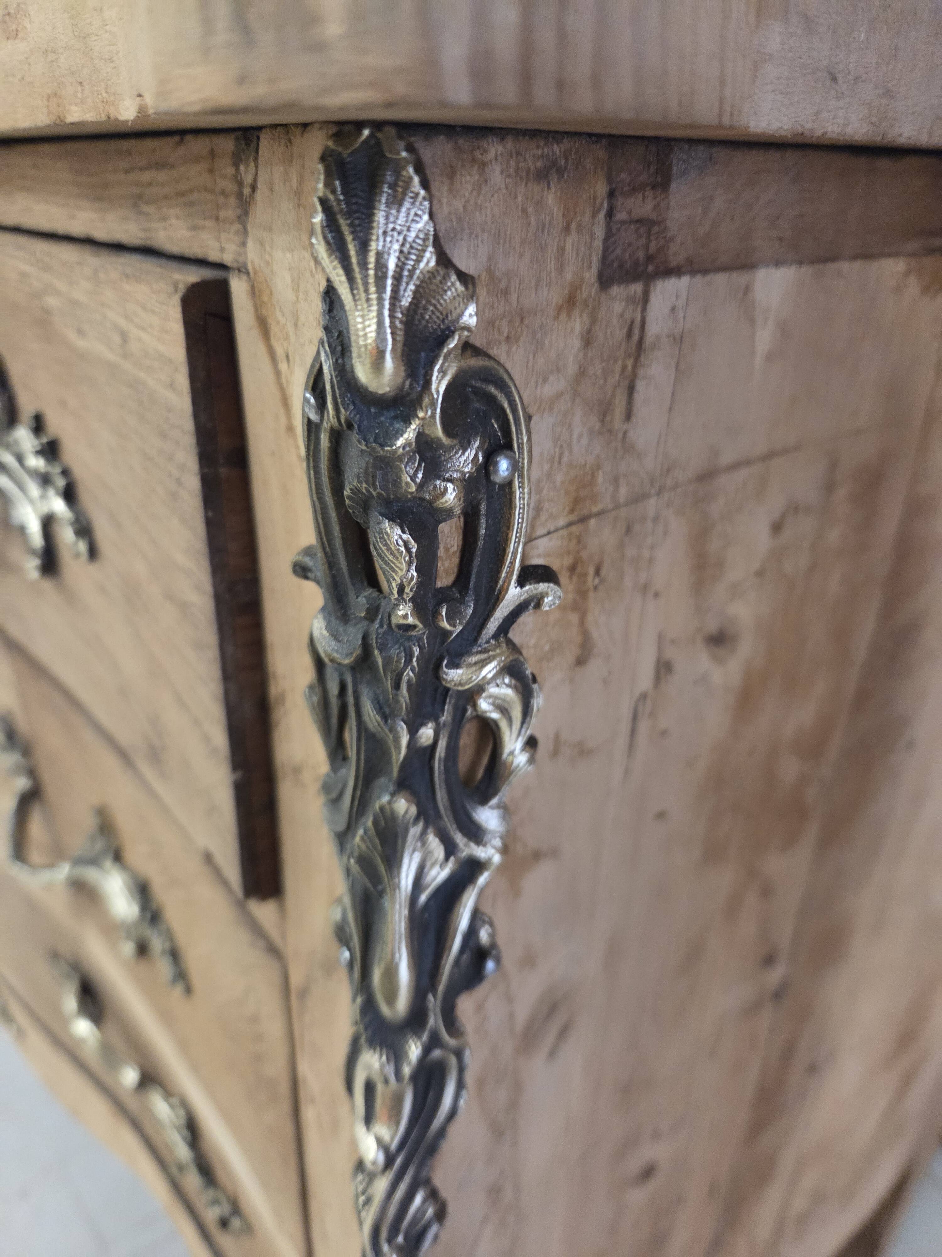 Stripped chest of drawers with bronze handles