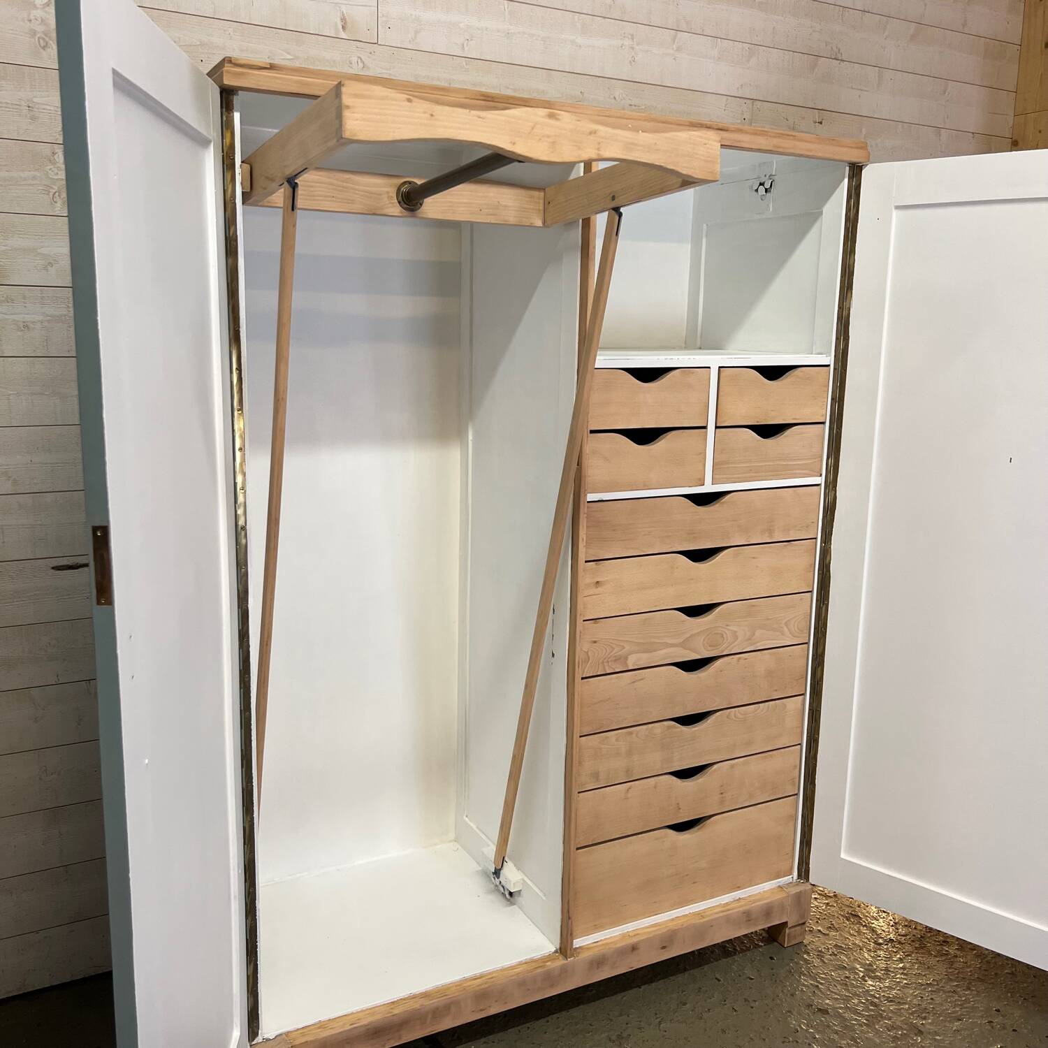 Wardrobe with two wardrobe compartments and drawers