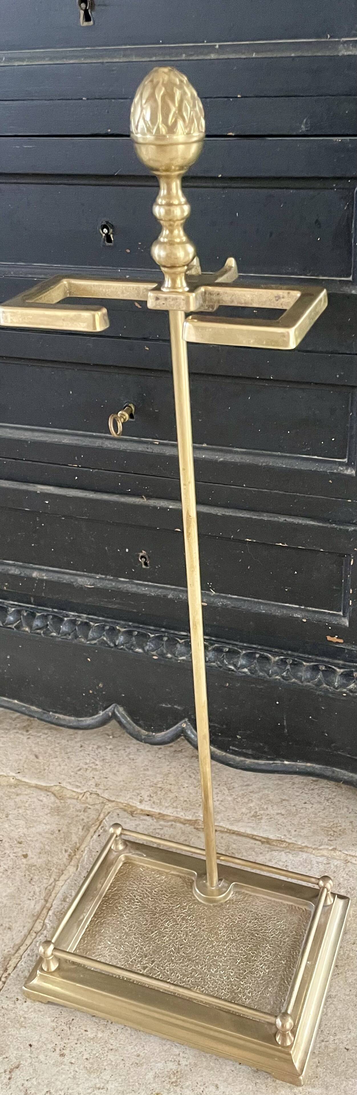 Brass fireplace tools in the style of Maison Baguès.
