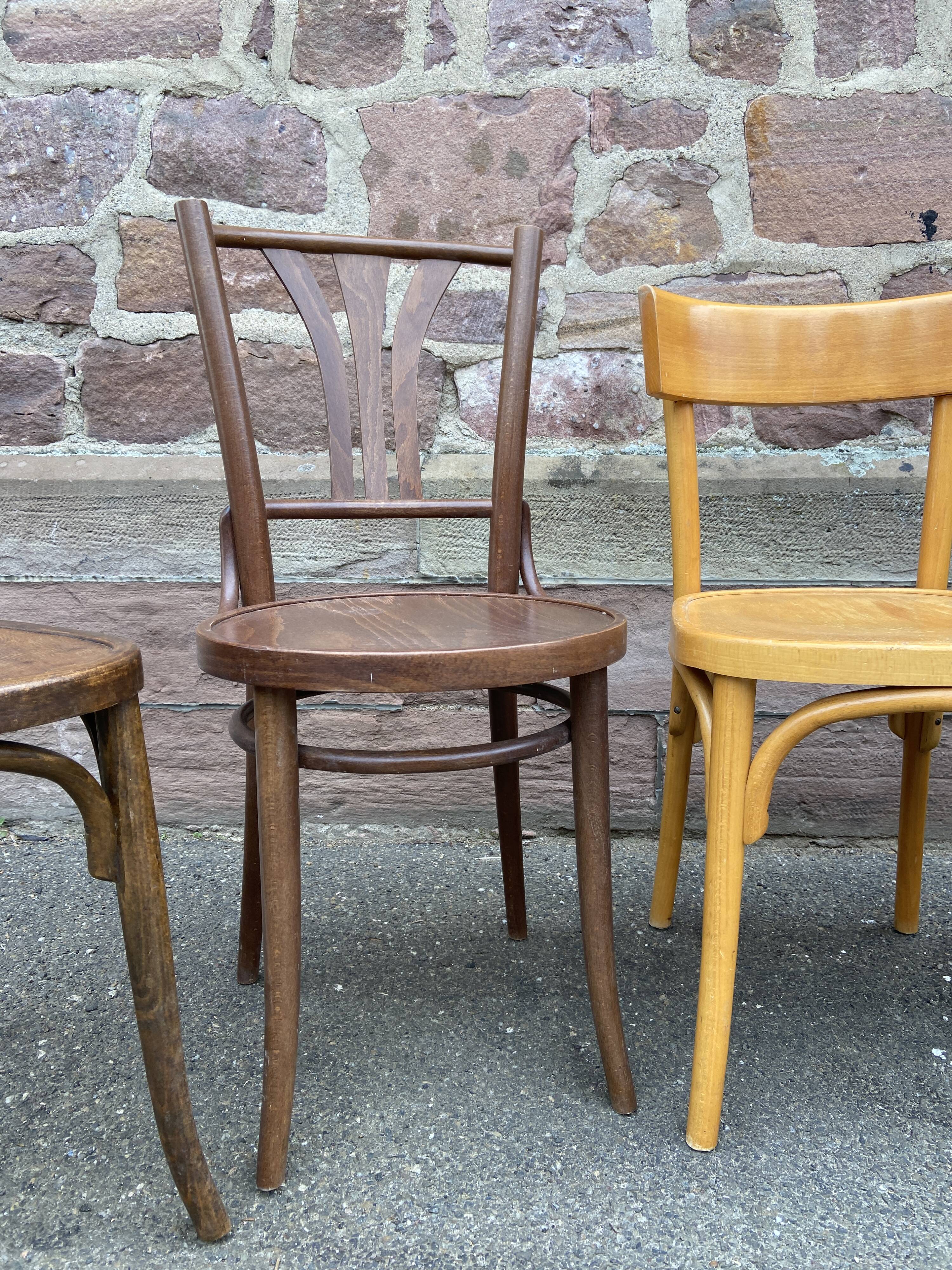 Lot 6 mismatched wooden bistro chairs