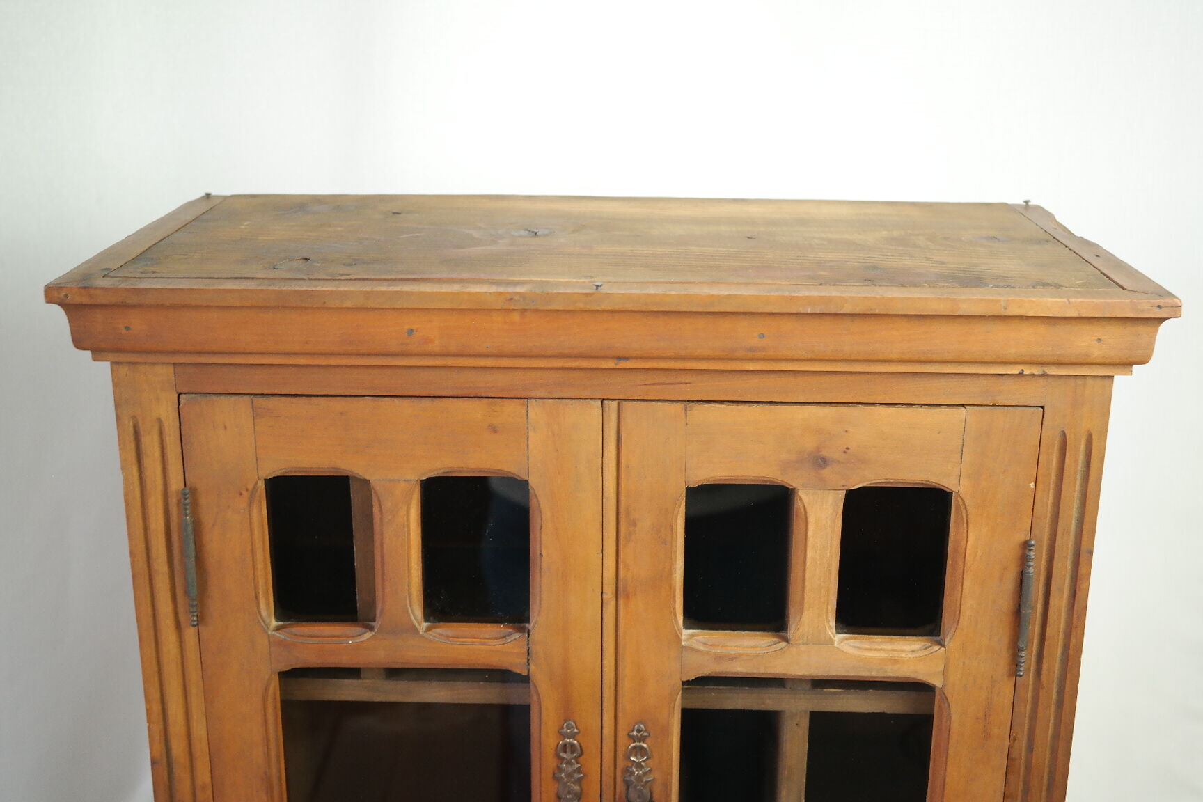 Antique walnut display cabinet from the 20th century.