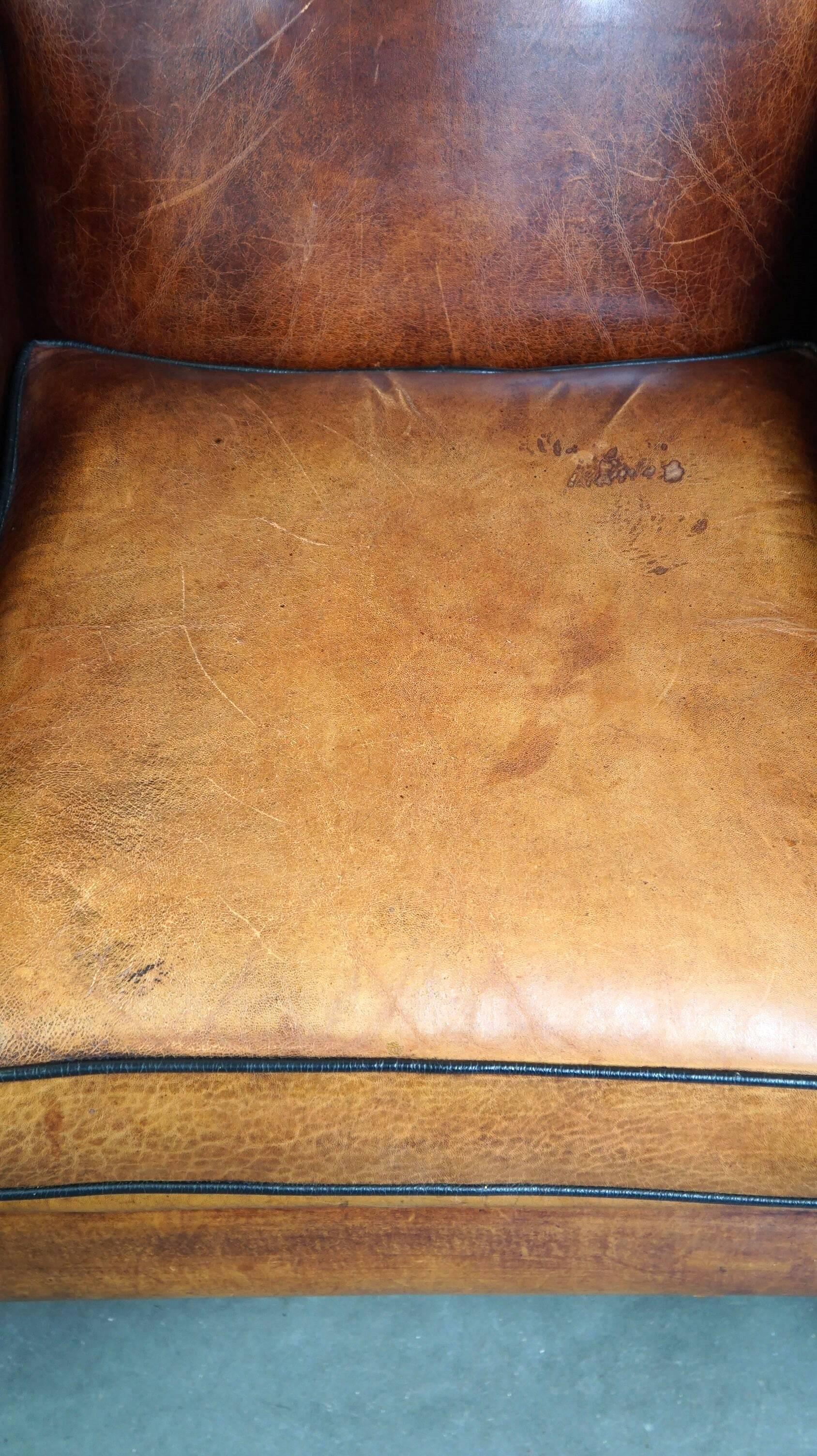 Sheepskin leather chair with a beautiful patina