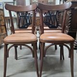 Set of 6 vintage curved wooden chairs, adorned with an elegant black lyre-shaped backrest.