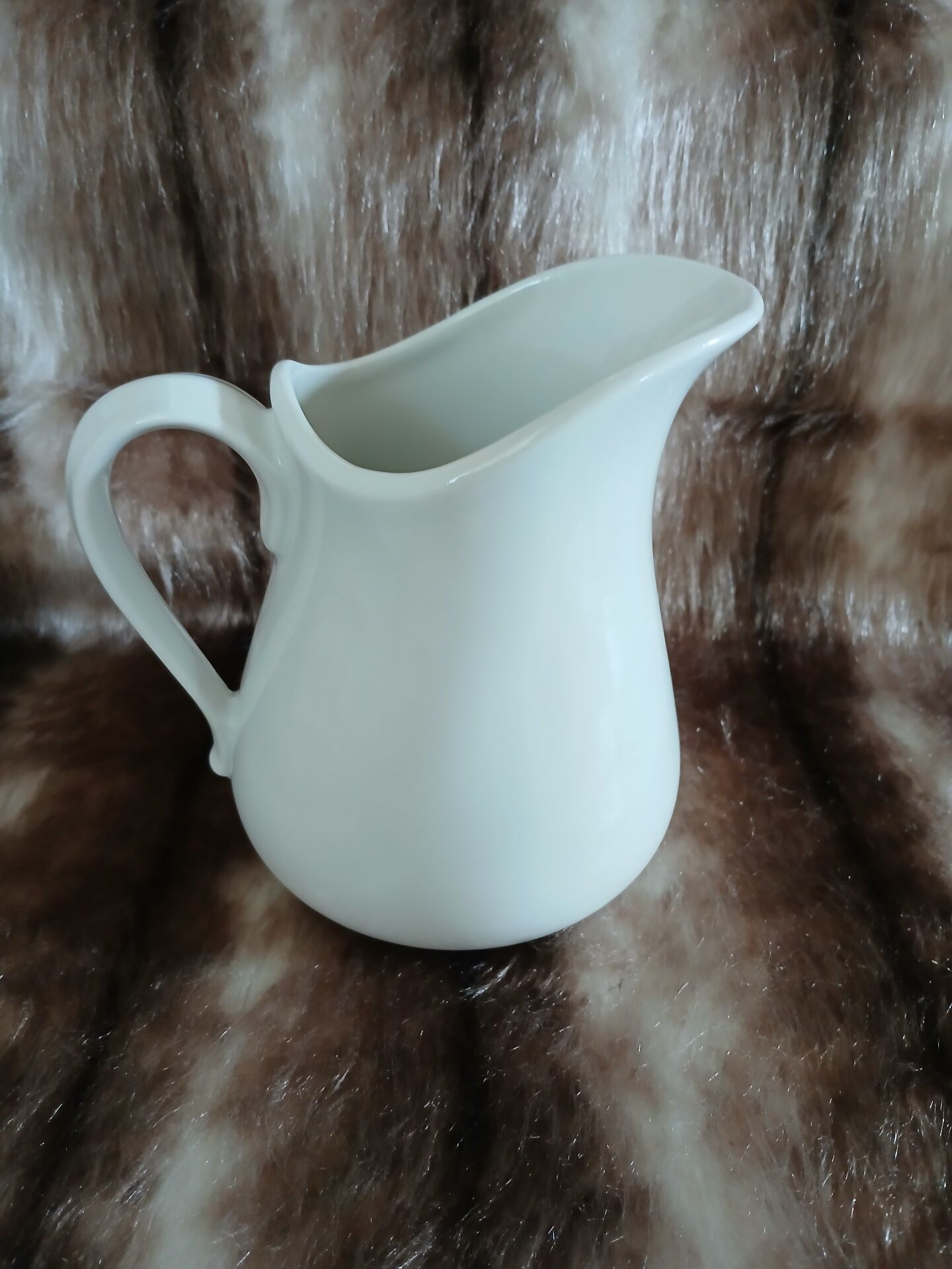 2 antique pitchers in white earthenware