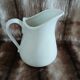 2 antique pitchers in white earthenware
