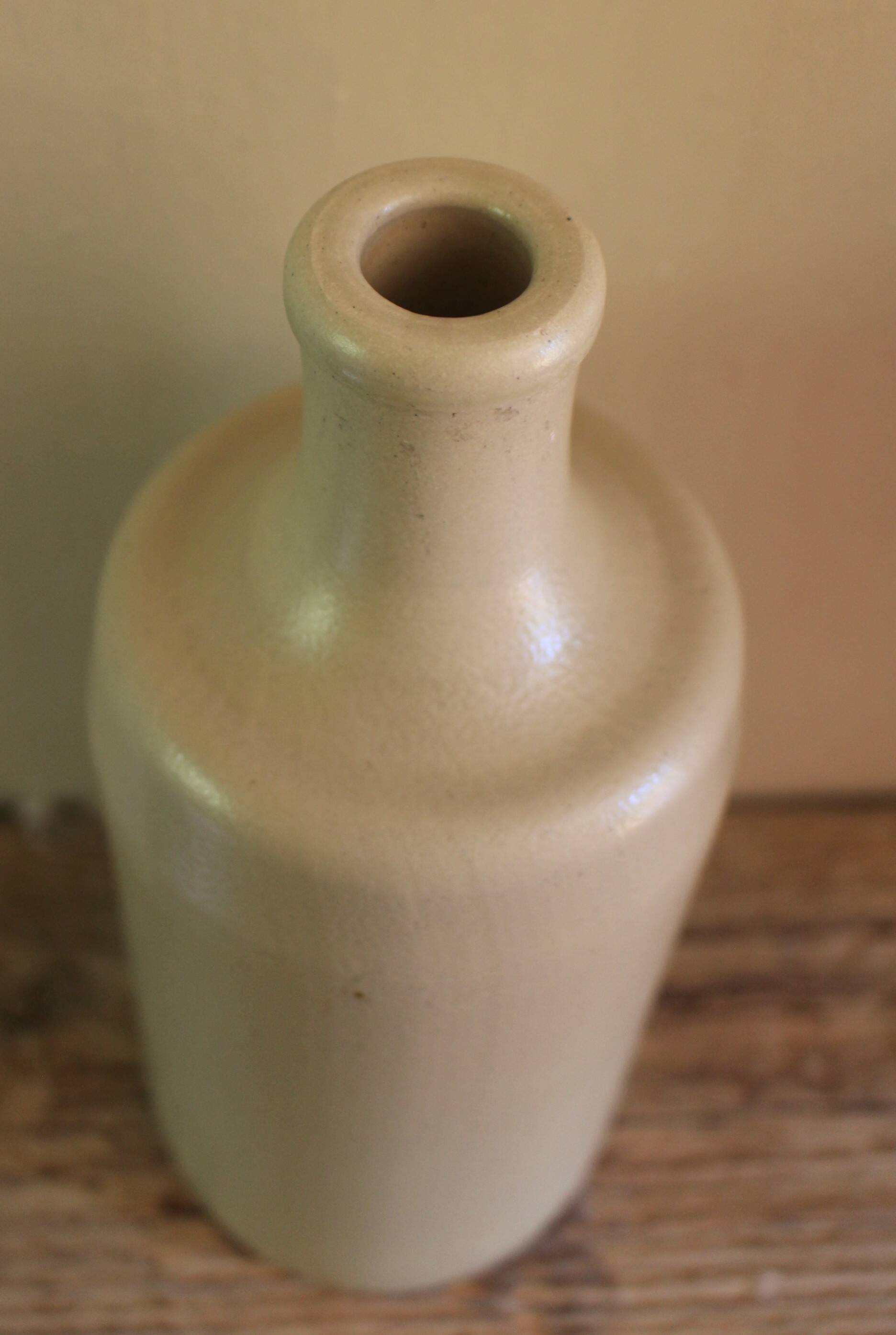 Vintage light stoneware liqueur bottle