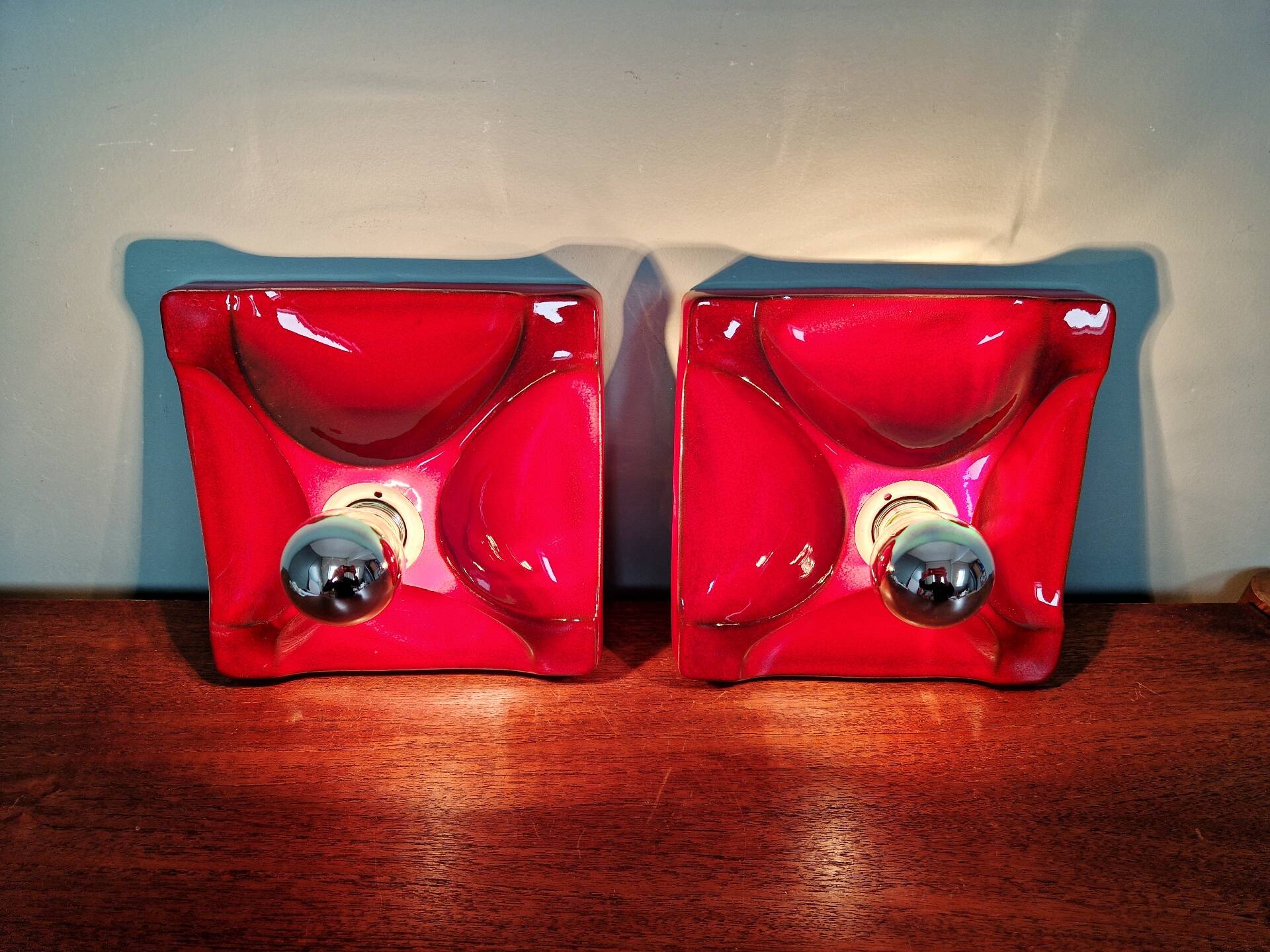 Pair of Space Age wall sconces in red ceramic, 1970.