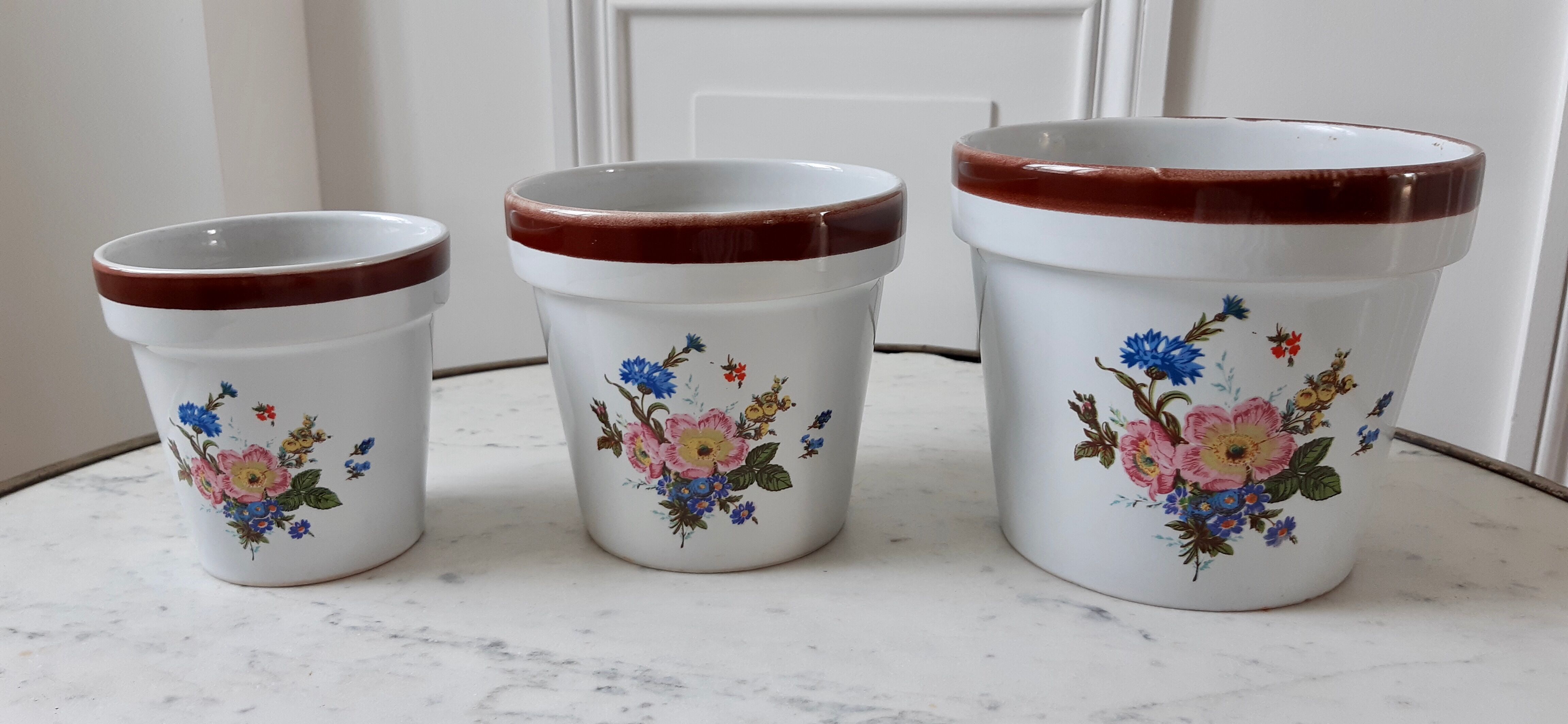 Trio of vintage flowered pot covers 60s