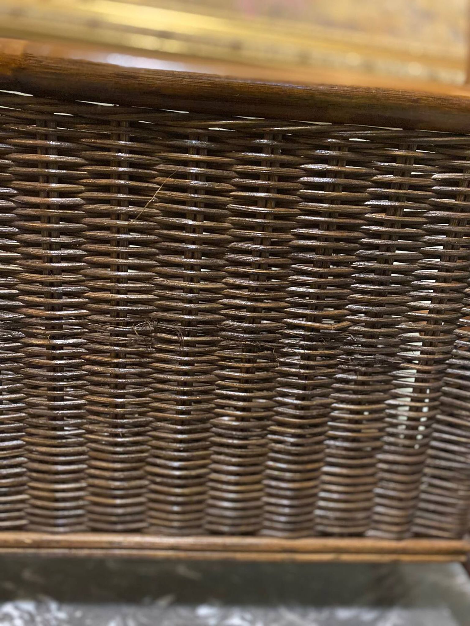 Wicker and brown wood magazine rack
