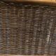 Wicker and brown wood magazine rack