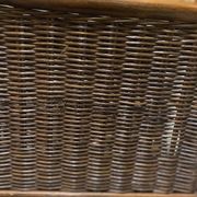 Wicker and brown wood magazine rack