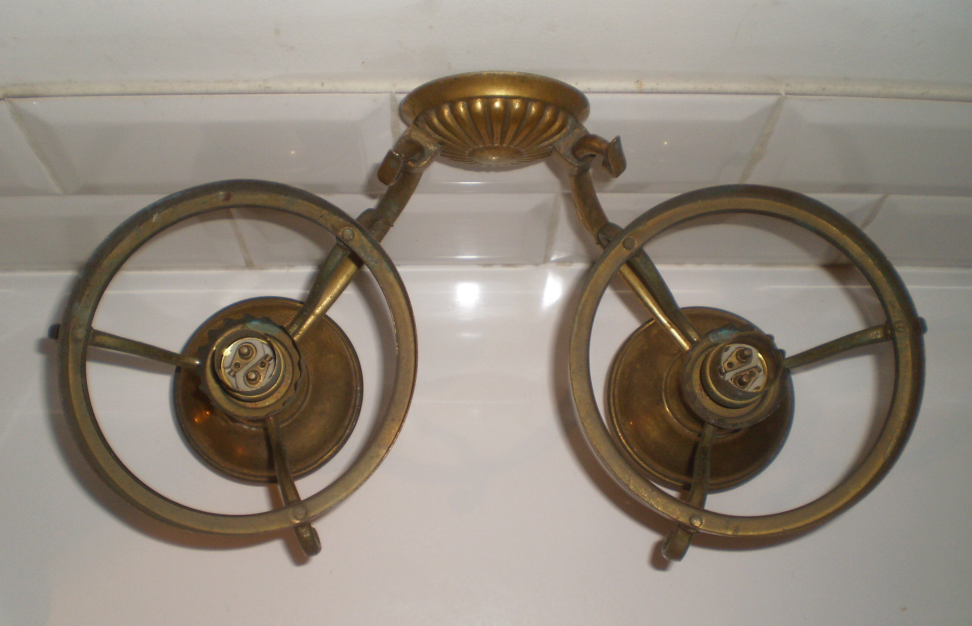 Glass brass globe sconce