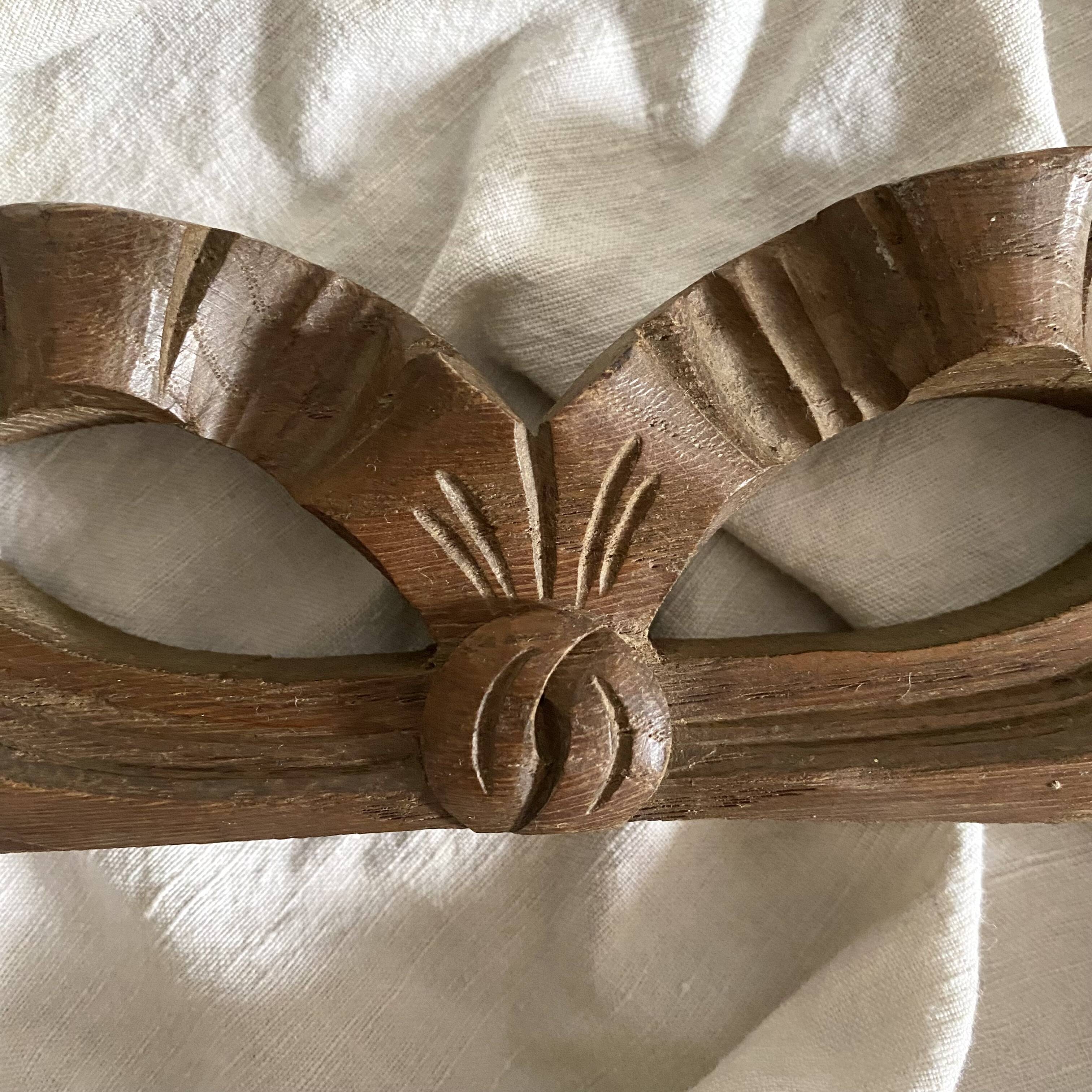 Antique carved wooden ribbon pediment