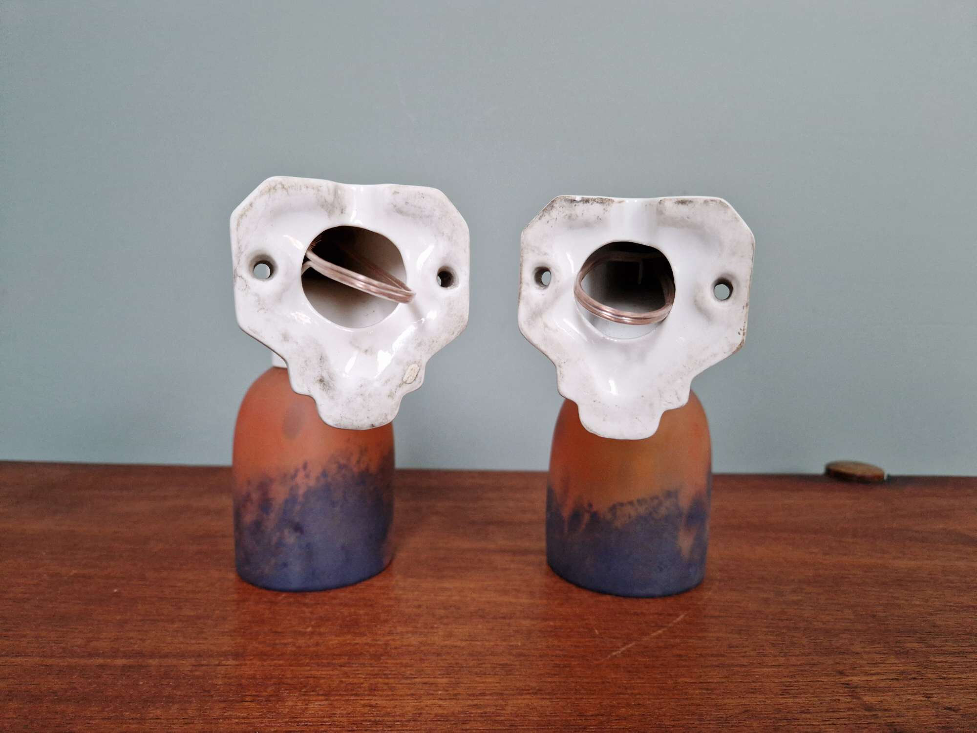 Pair of Art Deco wall sconces in multicoloured porcelain and frosted glass.