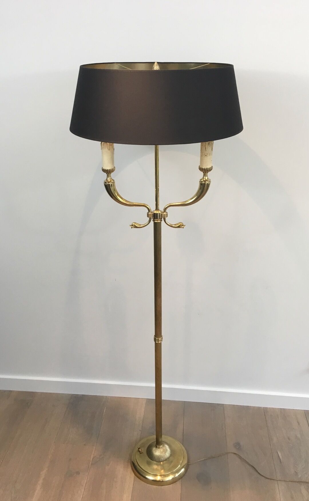 Floor lamp of parquet in neoclassical style in brass with dolphin heads
