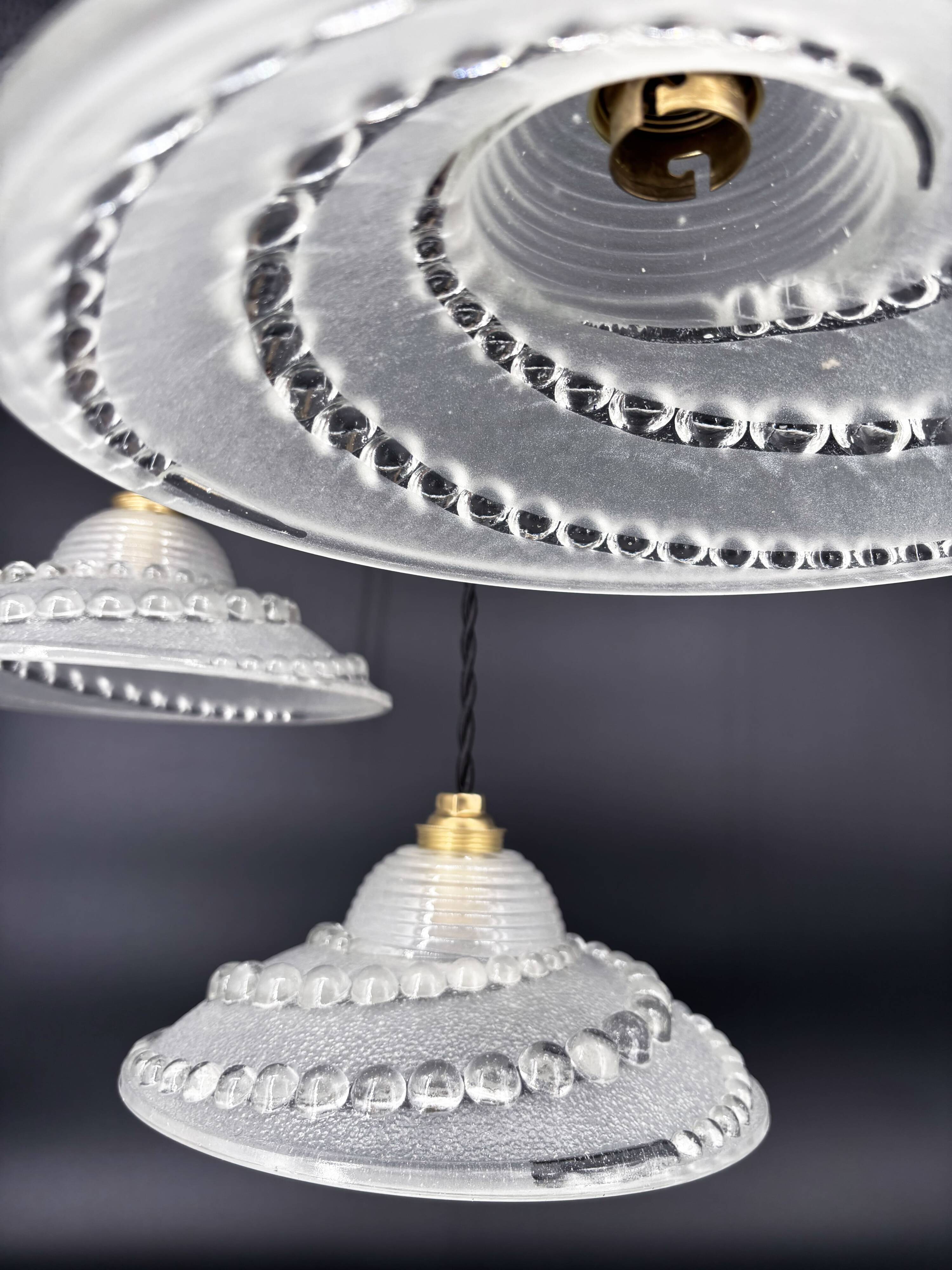 Set of 3 moulded glass pendant lights with cabochons, Art Deco style Ezan.