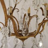 French Louis XV chandelier with 8 lights in gilded bronze, glass and crystal.