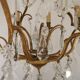 French Louis XV chandelier with 8 lights in gilded bronze, glass and crystal.