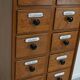 German Oak Apothecary Cabinet with Enamel Shields, 1940s