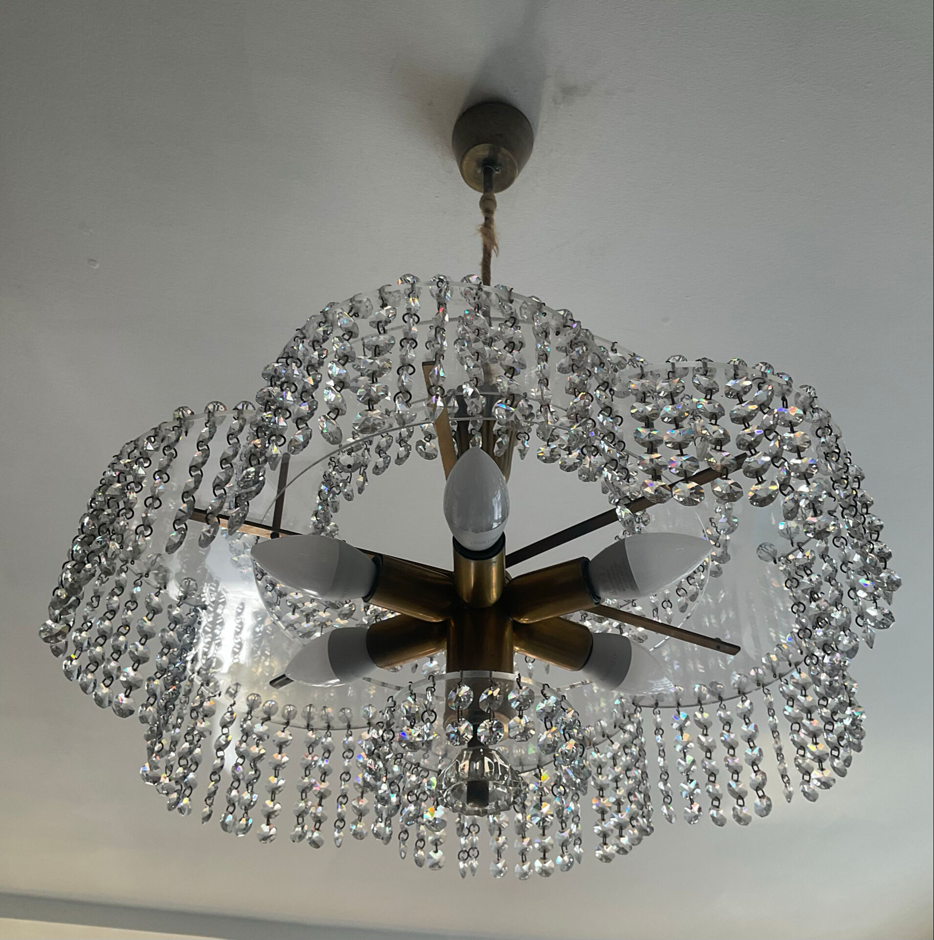 Vintage lucite chandelier with a cascade of crystal pendants from the 1970s.