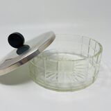 Vintage box made of chiseled glass and covered metal, taken in black Bakelite