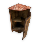 Louis XVI style corner buffet with marquetry decoration featuring a vase of flowers
