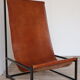 Pair of vintage armchairs in stretched leather and metal structure