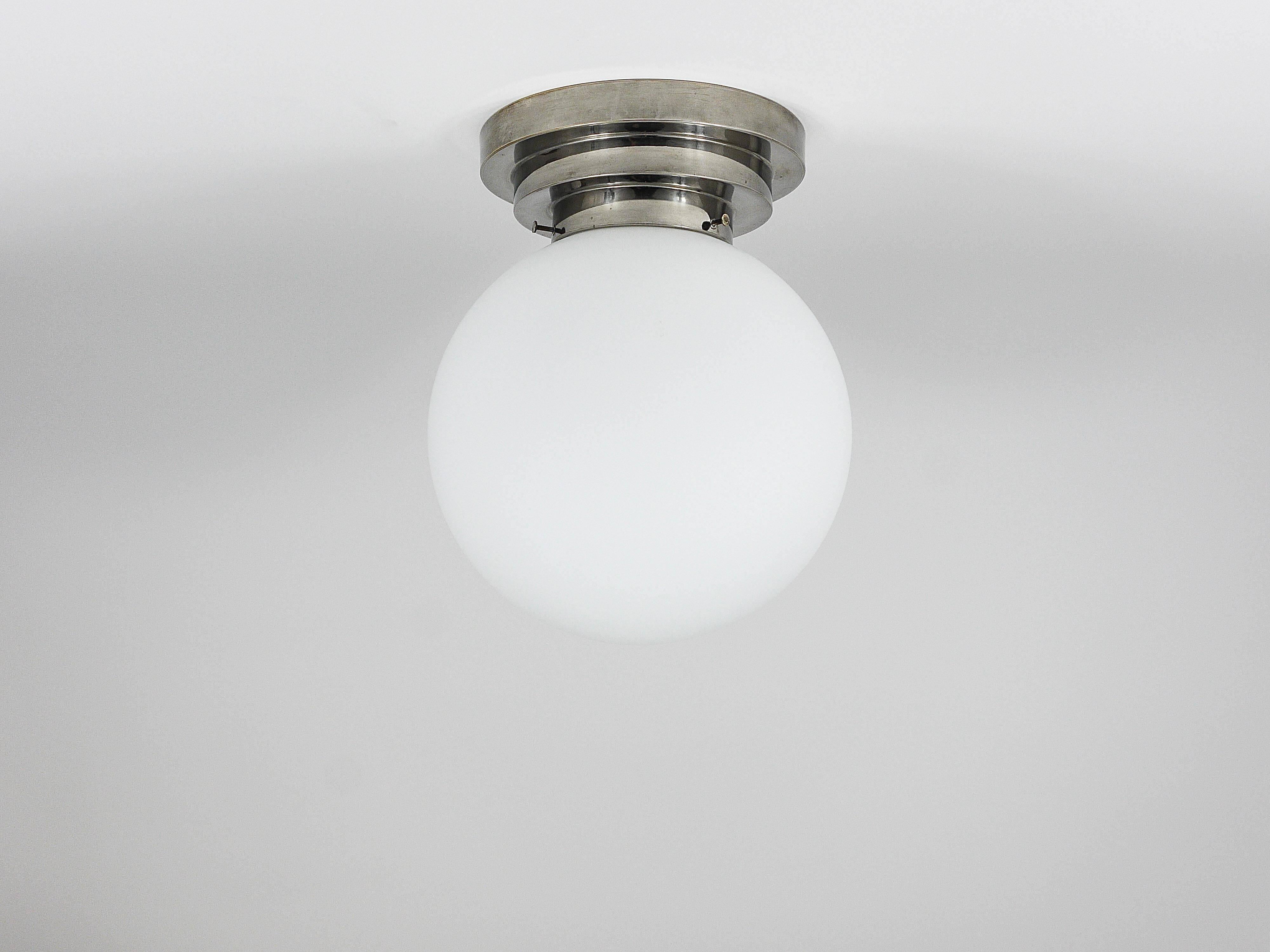 Large opaline glass globe ceiling lamp in Art Deco style.