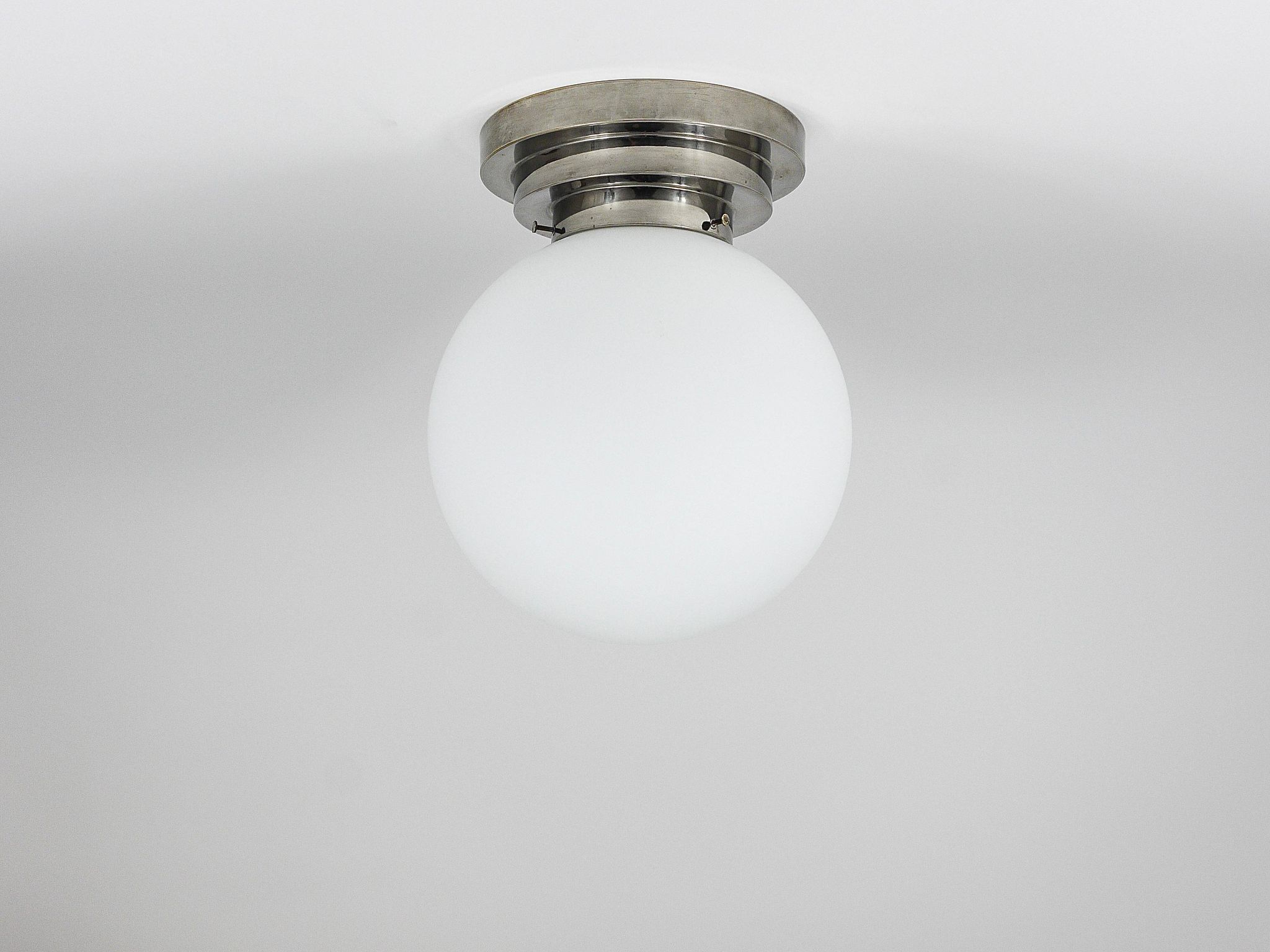 Large opaline glass globe ceiling lamp in Art Deco style.