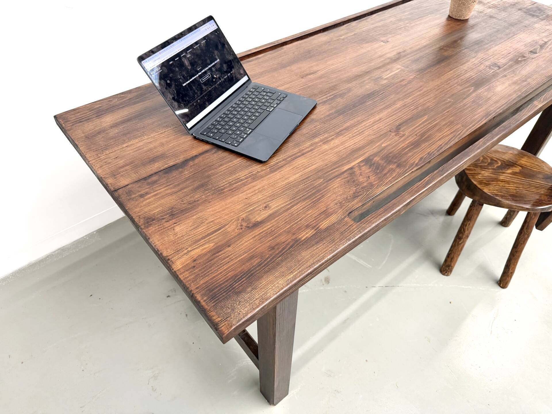Solid pine workbench, grooved top, satin brown finish.