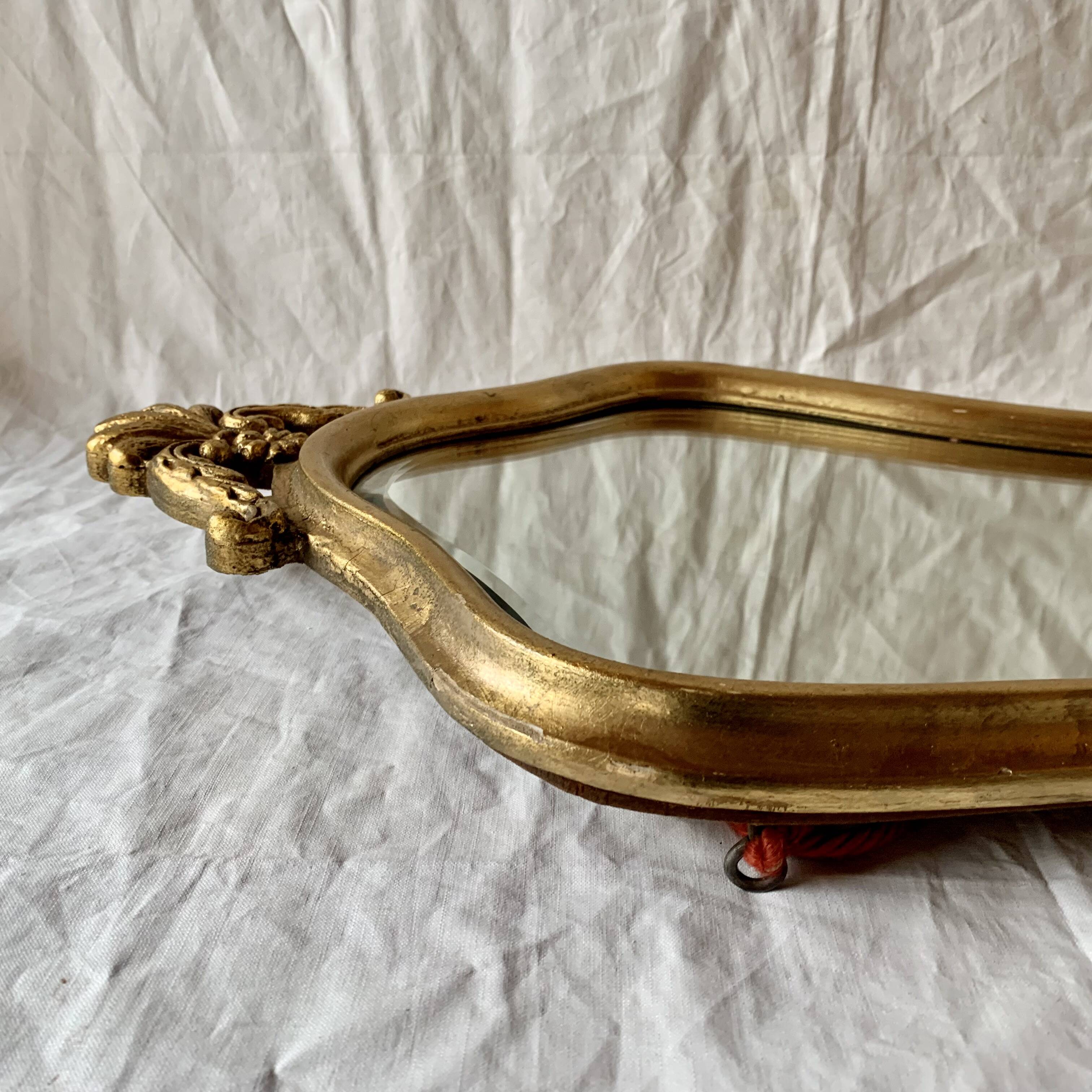 Antique beveled wall mirror in gilded solid wood