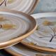 Six assiettes en grès de Niderviller au décor végétal vintages