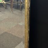 Large mirror with a gold frame
