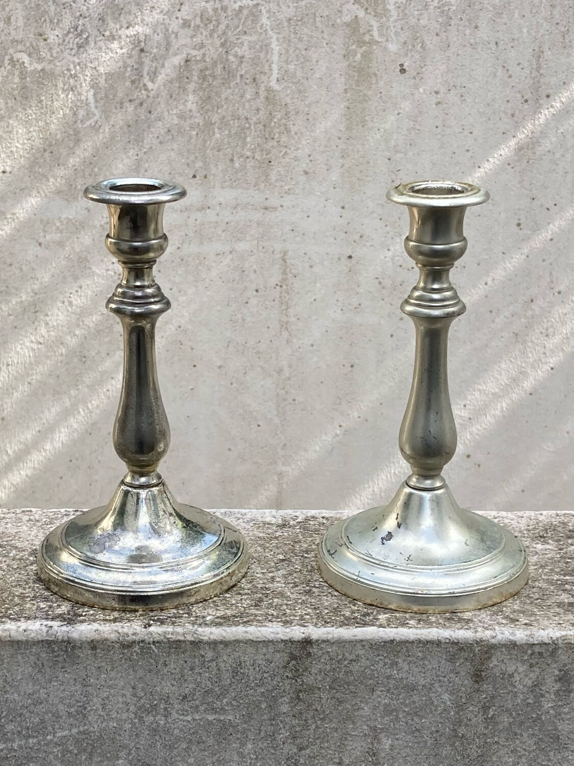 Two antique candle holders