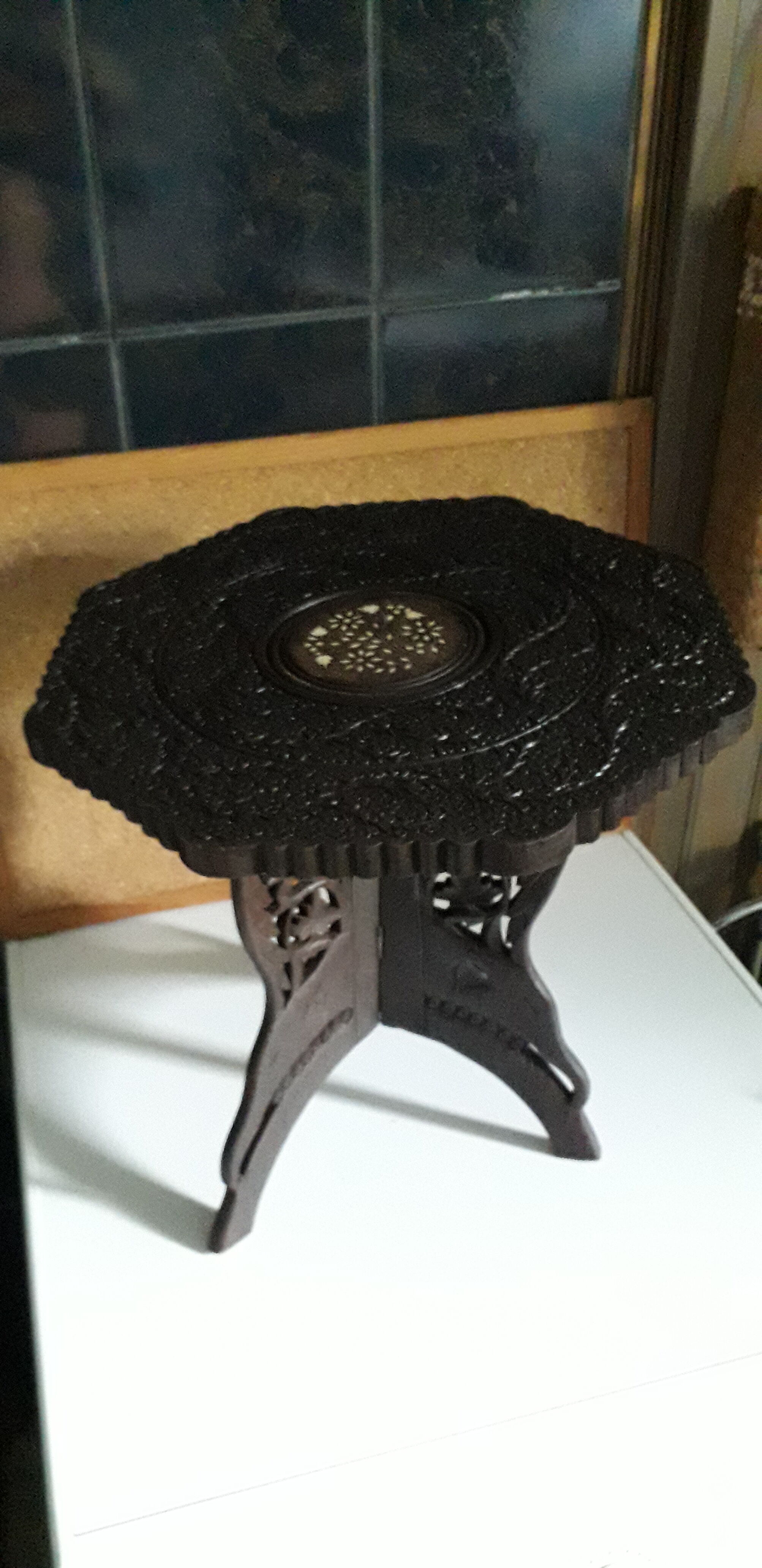 Old coffee table carved in teak wood