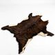 Vintage striped hide rug, natural brown and cream.