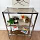 Stainless steel shelf and smoked glass