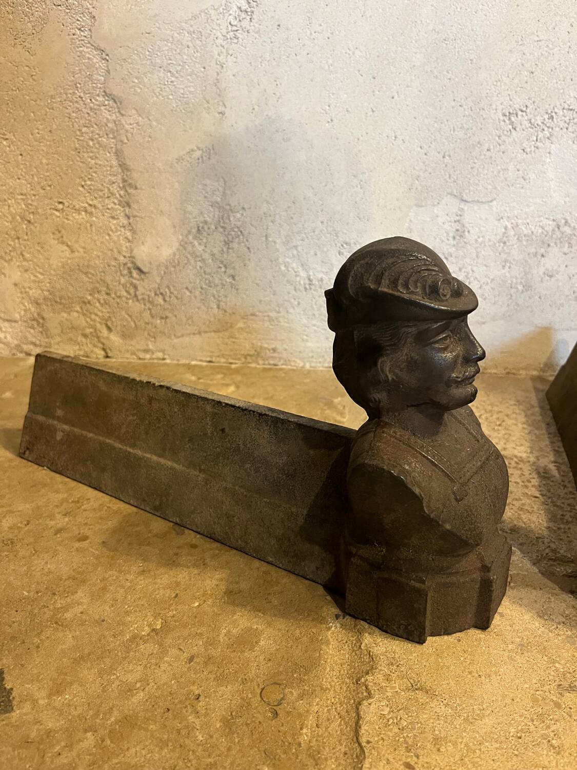 Pair of cast iron andirons with face