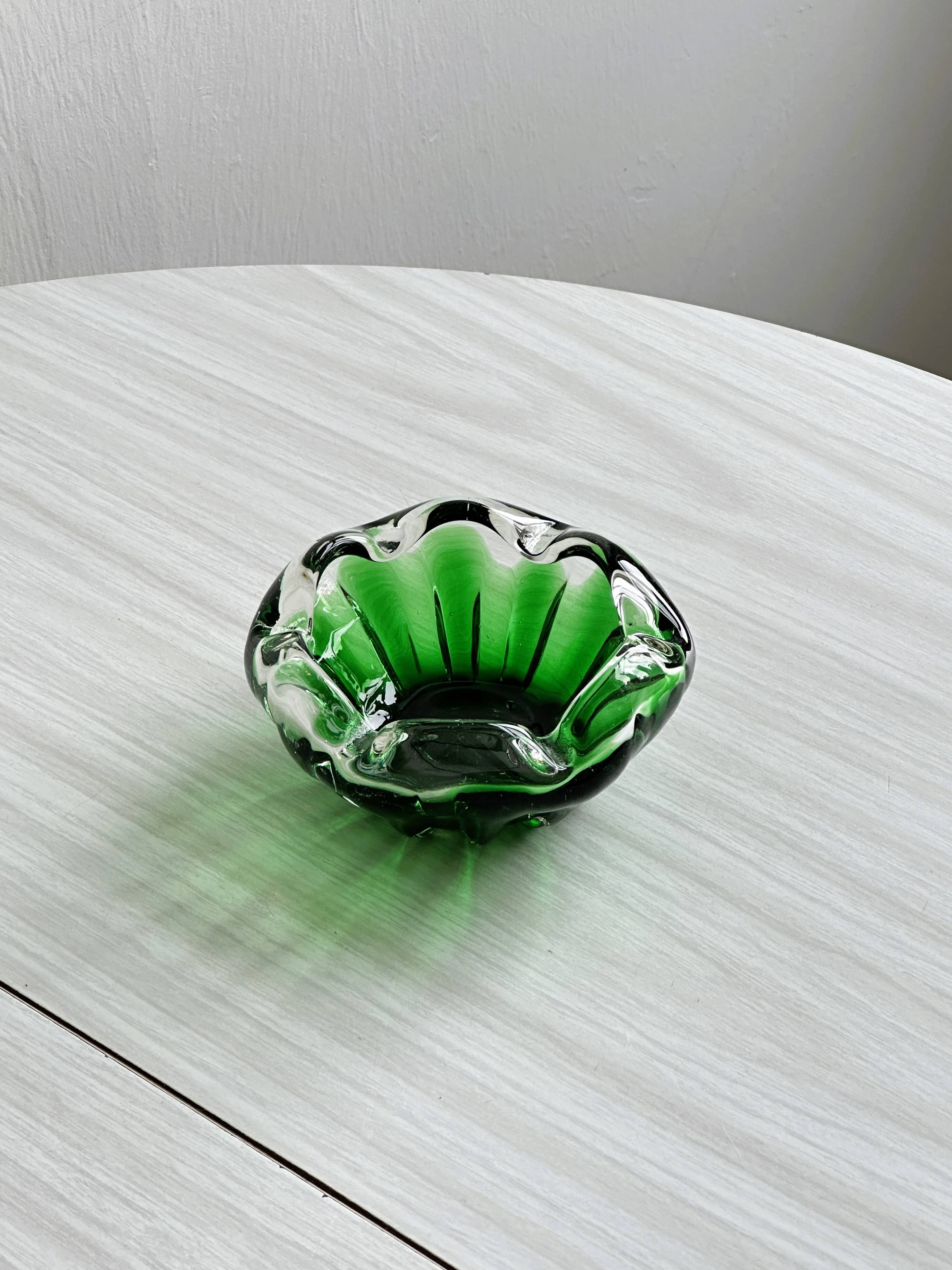 Translucent green ashtray.