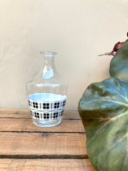 Vintage decanter with black and white tiles