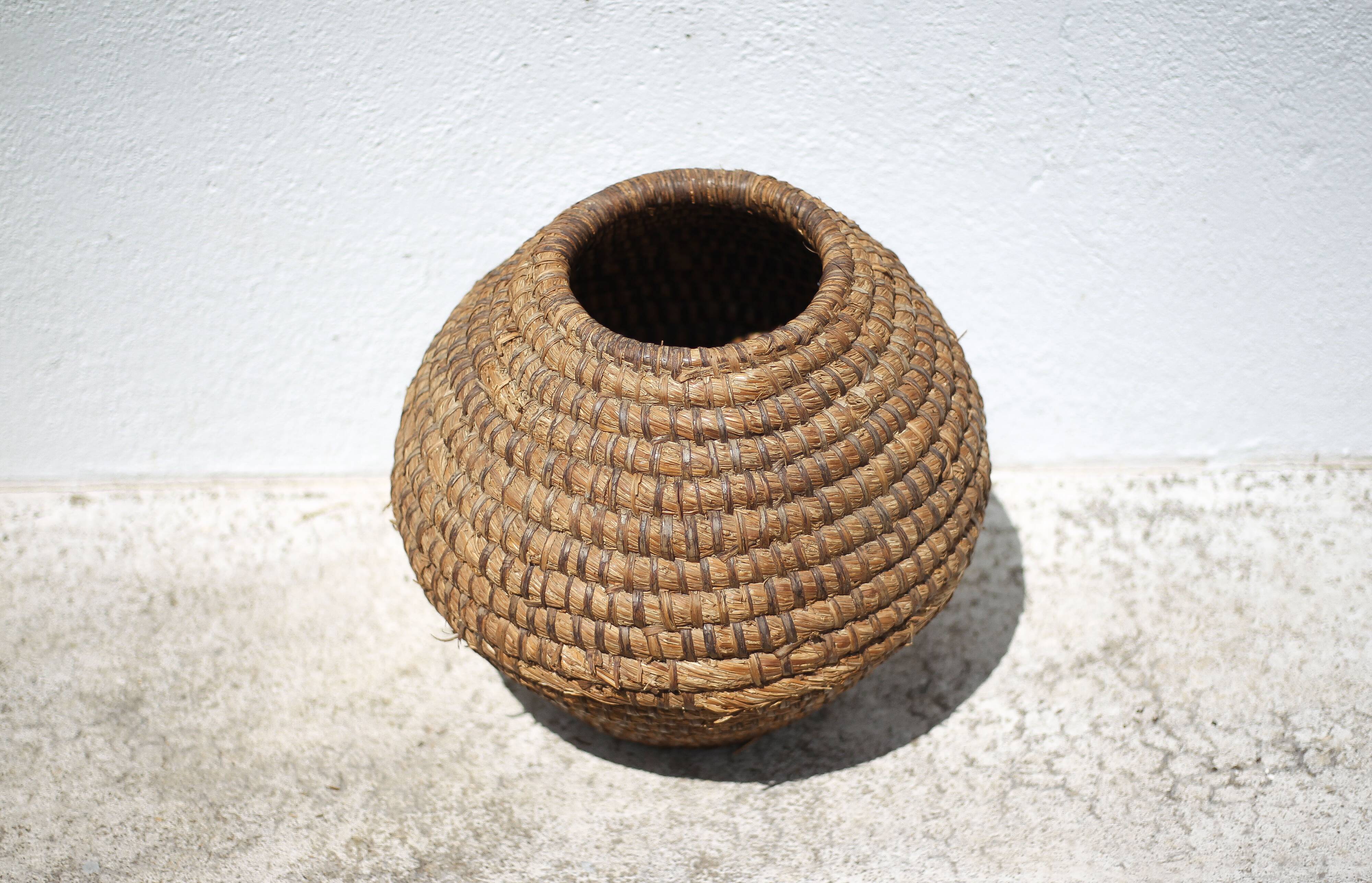 Old basket, burgundy straw and bramble, woven basket, interior decoration