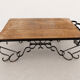 Antique solid wood coffee table with integrated wine rack.