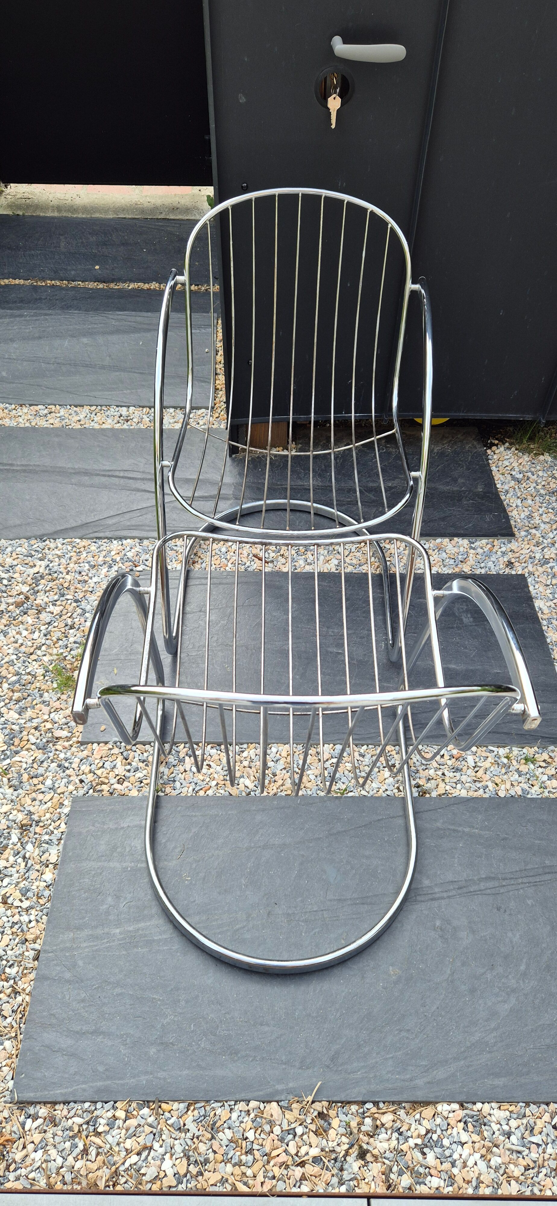 A pair of space age wire chairs