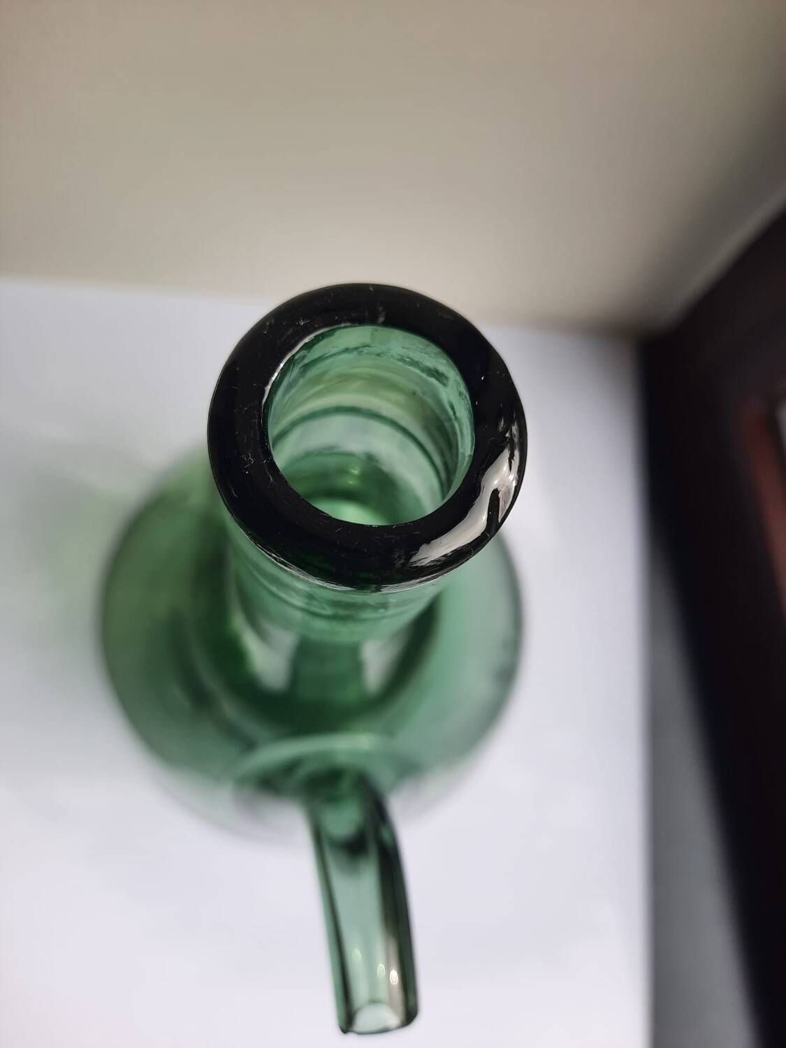 Pair of blown glass wine decanters in blue/green hues.