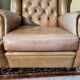 Pair of Chesterfield leather wingback armchairs