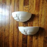 Wall sconces in stone and in the shape of a basin