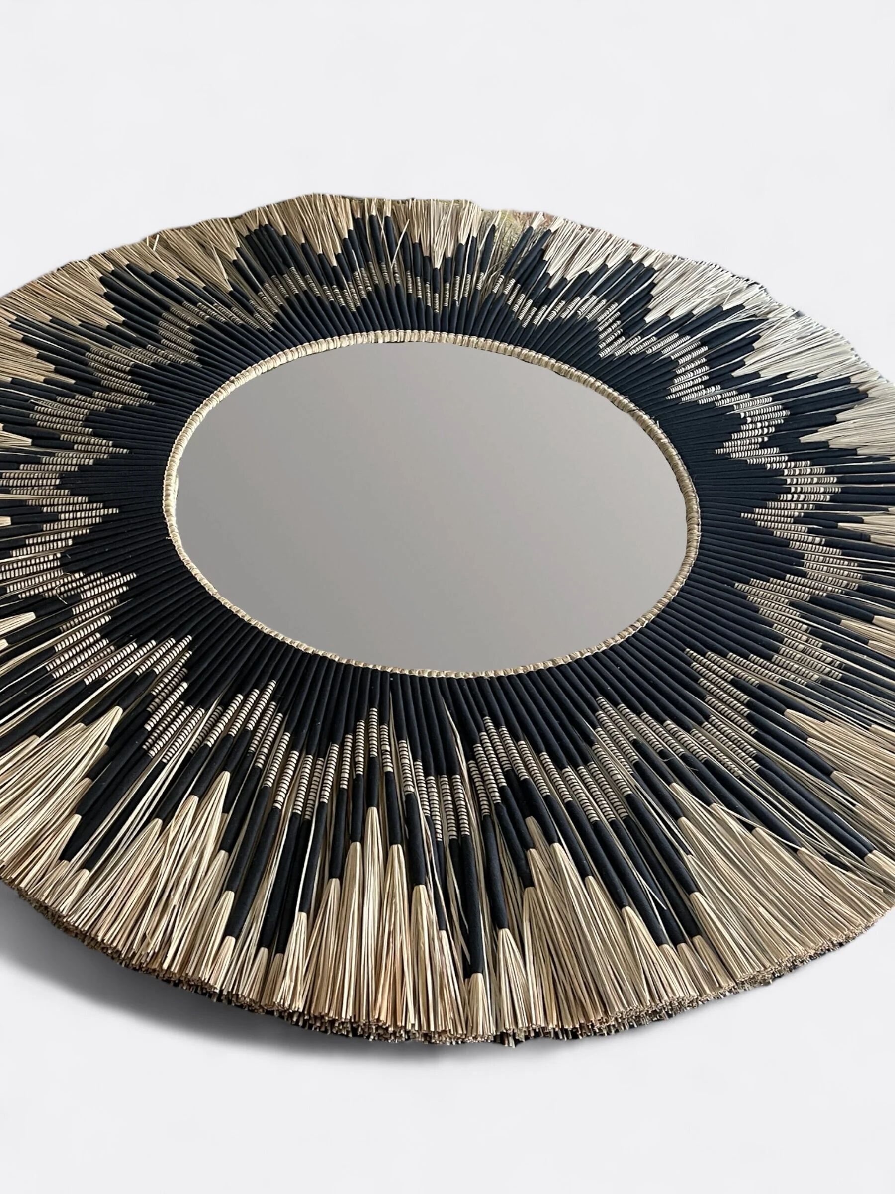 Large round handcrafted mirror in reed
